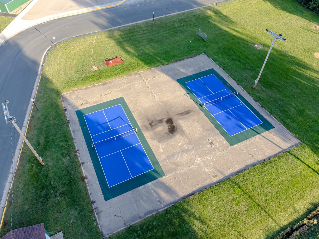 A row of outdoor pickleball courts